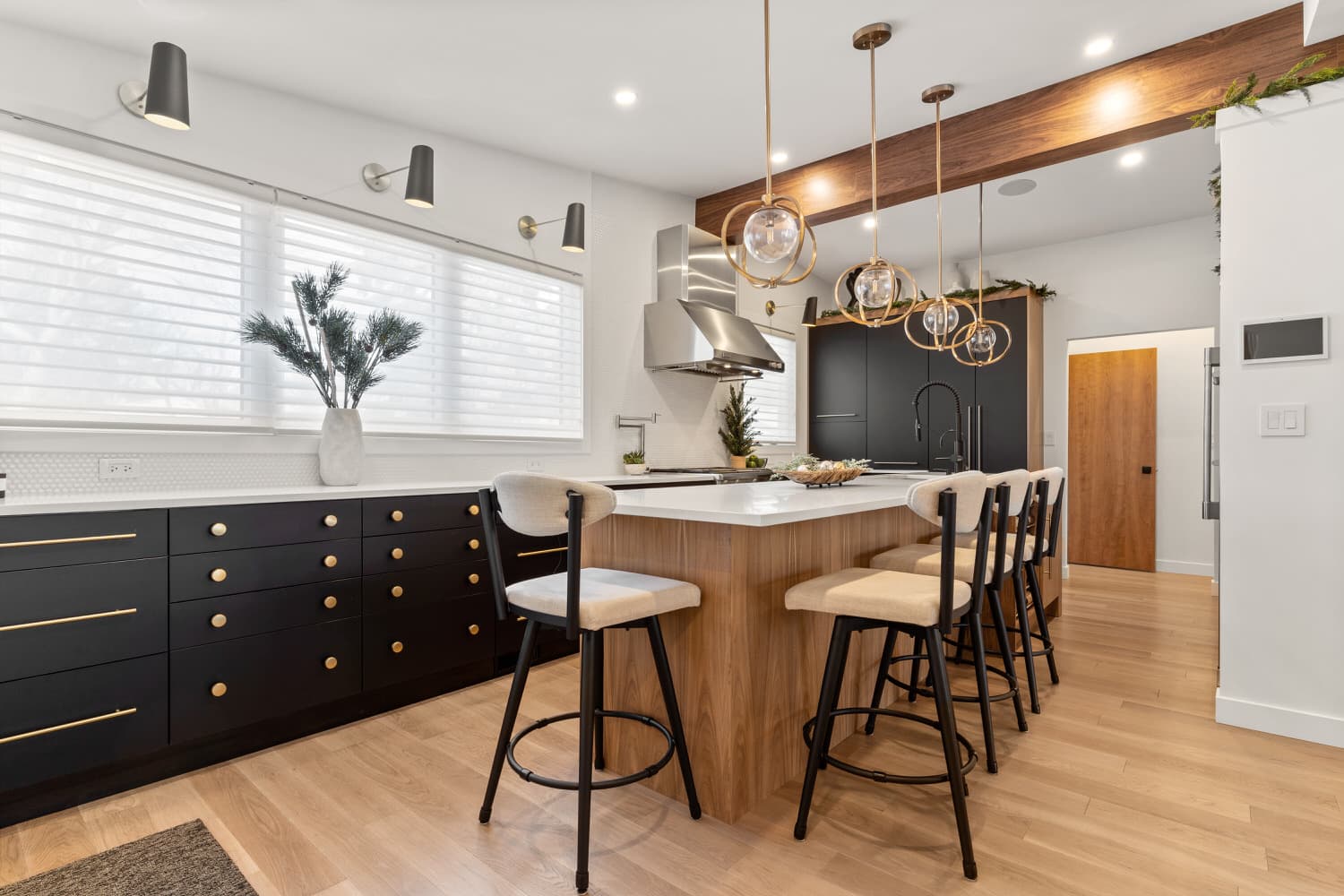 Black and walnut kitchen with globe pendant lights