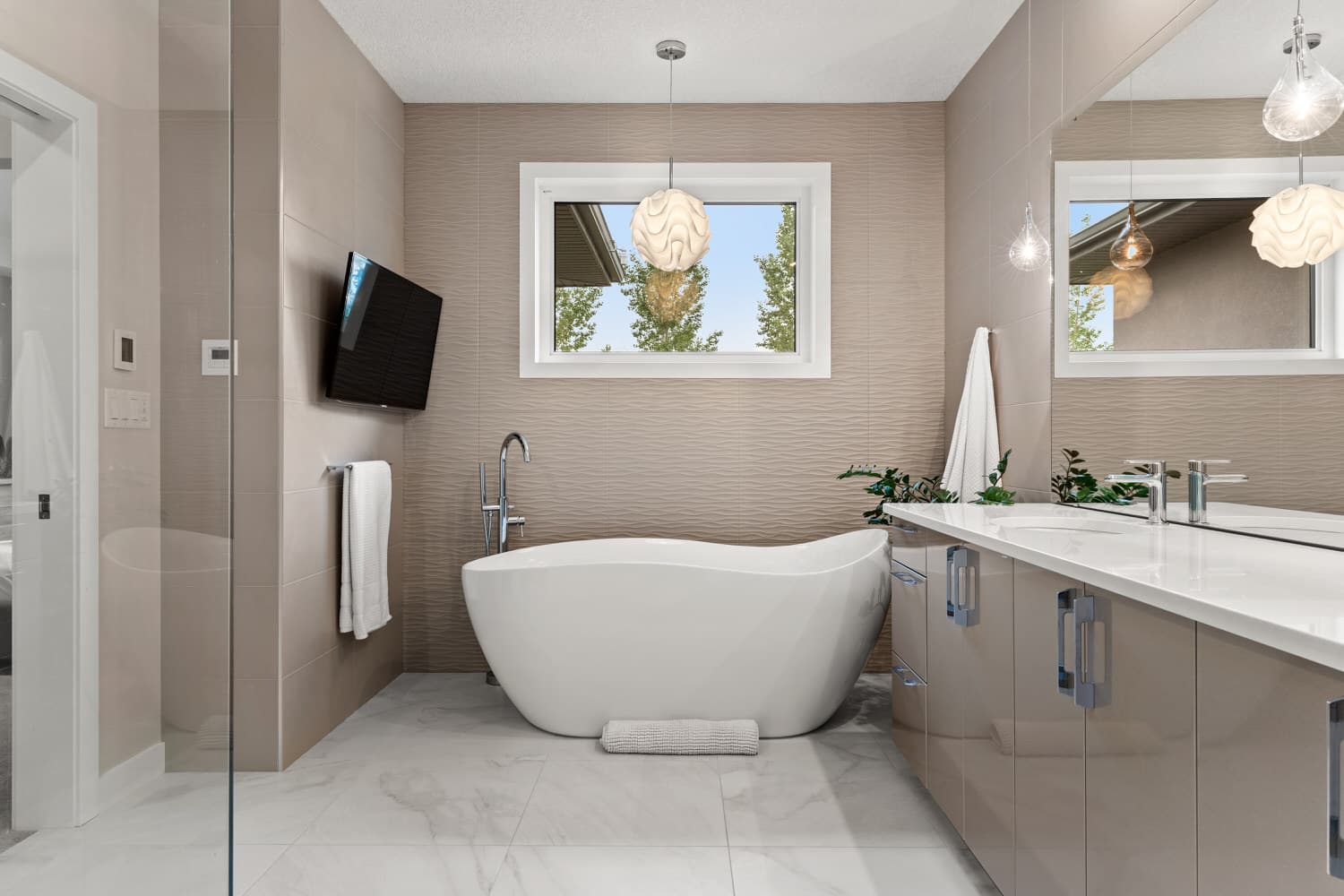 Spa-style ensuite bathroom with freestanding soaker tub